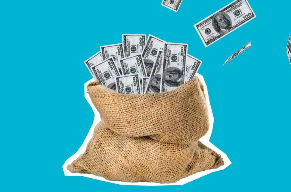 Burlap sack filled with hundred dollar bills against a clean blue background, symbolizing wealth and savings.