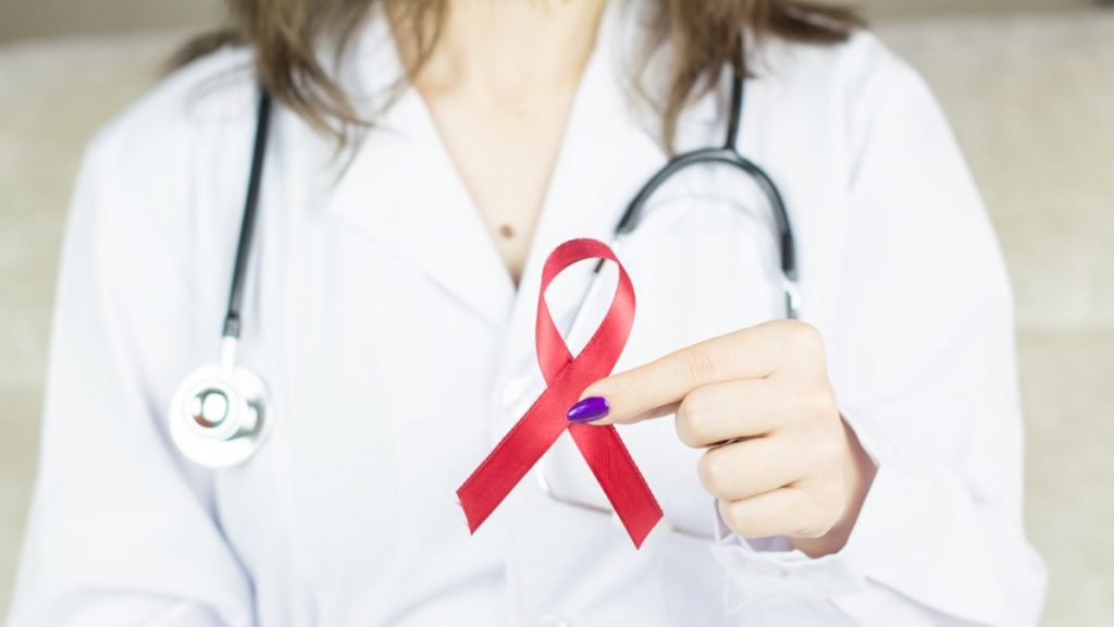 Woman doctor holding red ribbon HIV, world AIDS day awareness ribbon. More of my photos and videos Adobe Stock:http://bit.ly/3RqlciK More of my photos and videos Shutterstock: https://www.shutterstock.com/g/ALEKSANDRBERDYUGIN My email: bermix999@gmail.com